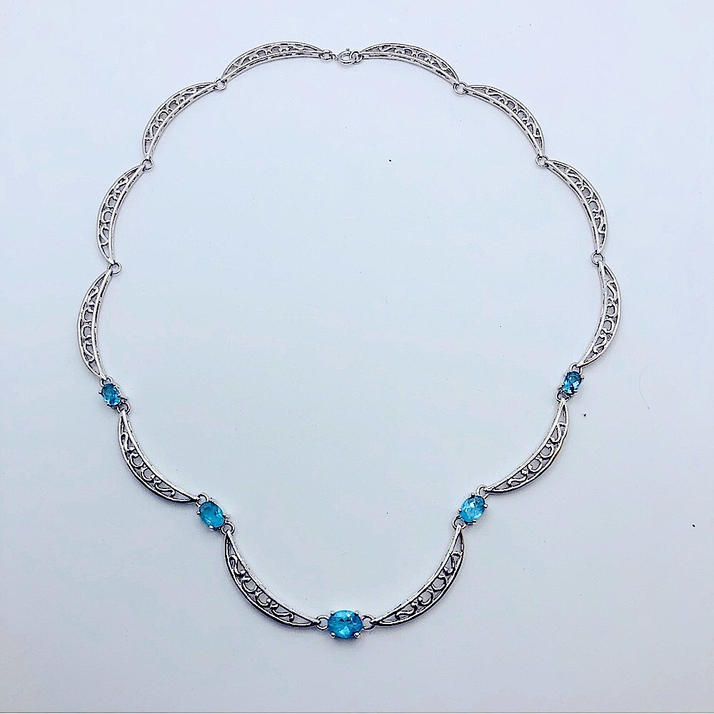 - Unknown brand necklace with five light blue Jews.